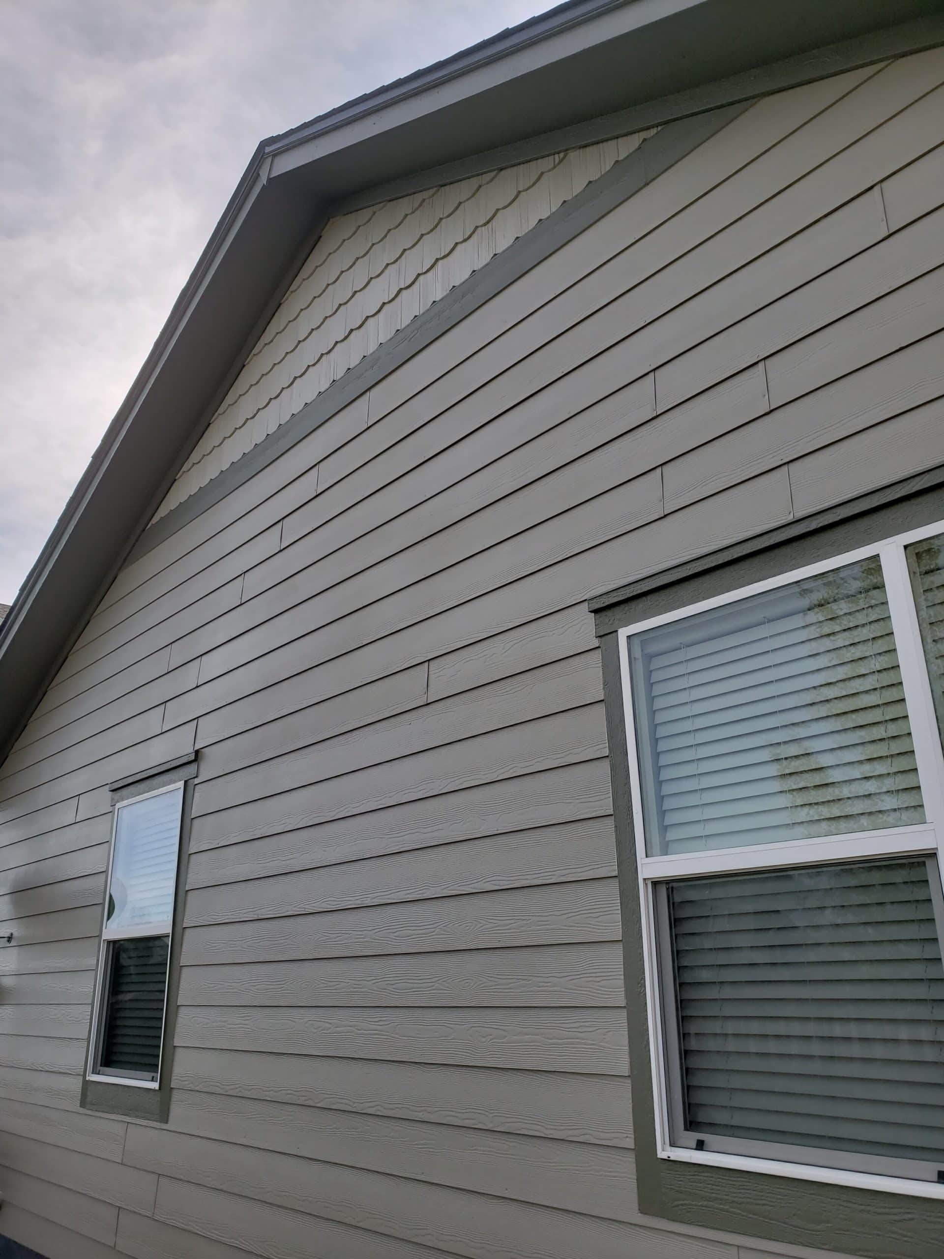 Outdoor close-up showing windows and siding of a home
