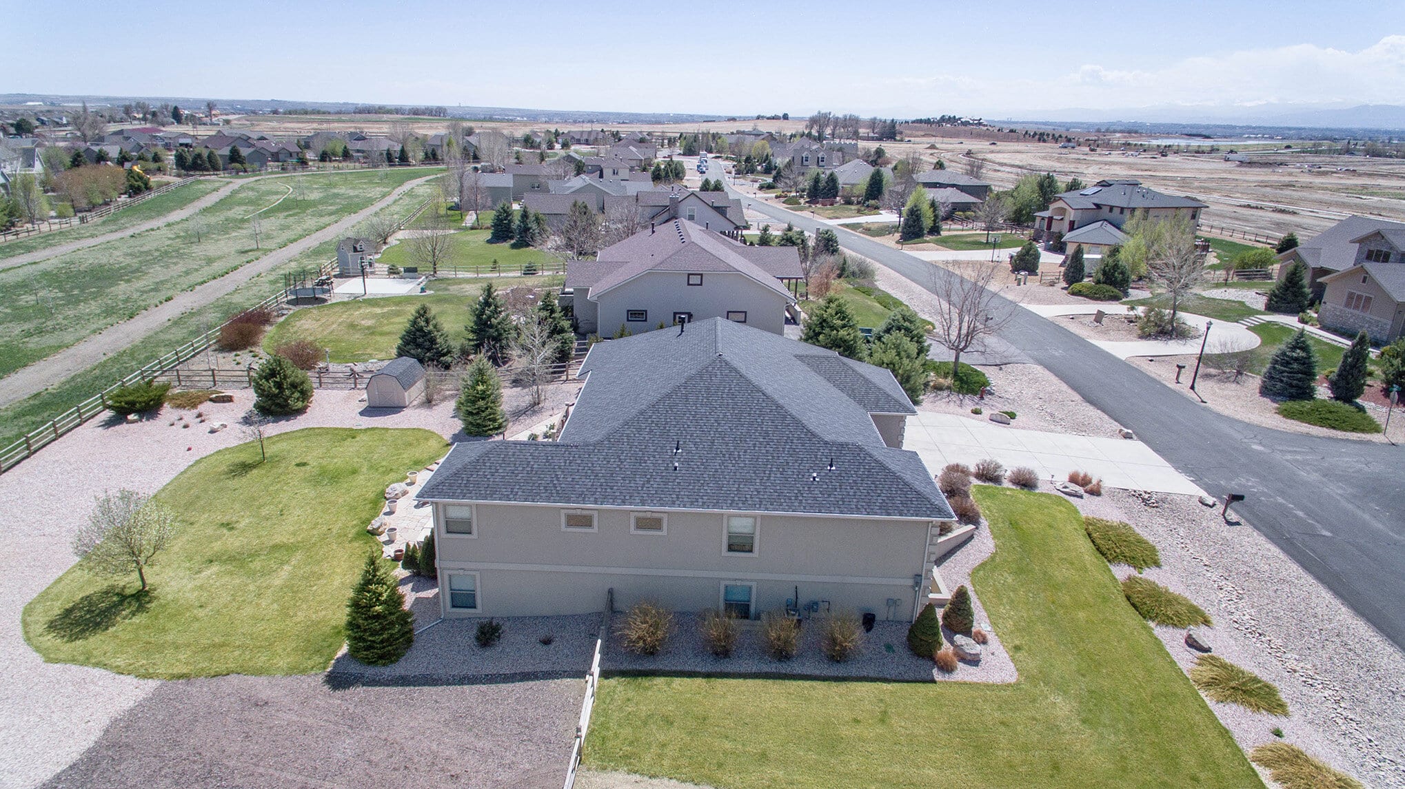Aerial view of a large home in a Colorado neighborhood