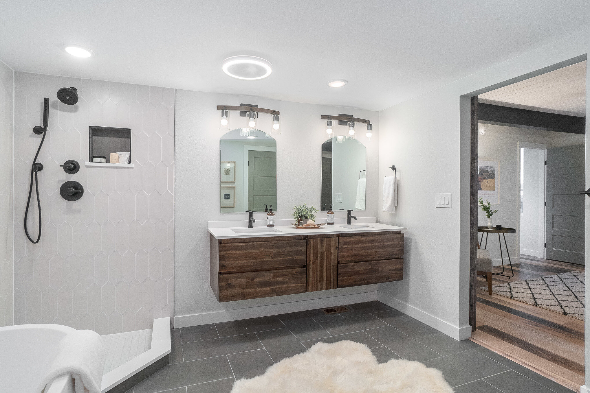 Floating double vanity in large owner's suite bathroom