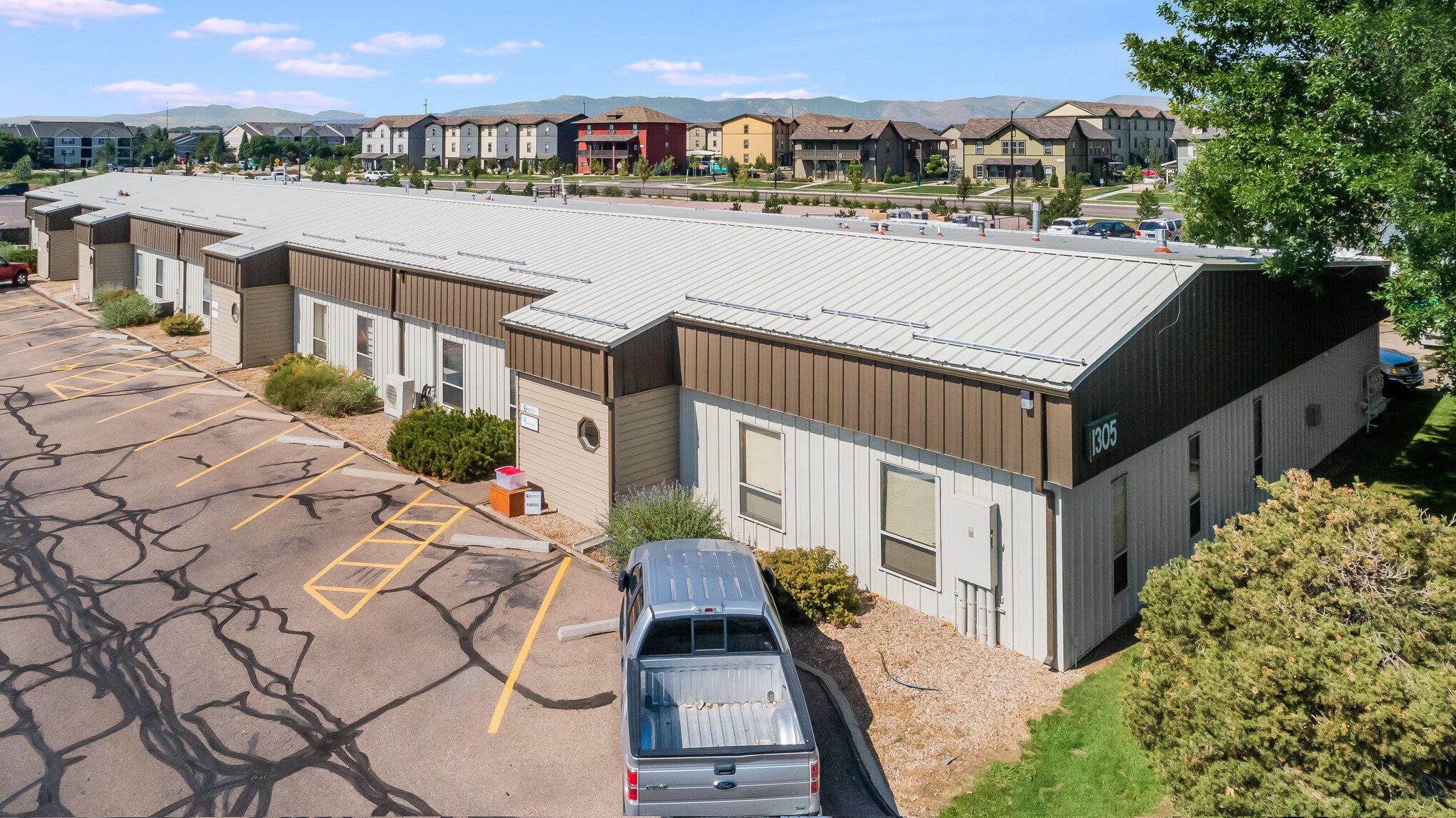 Corner aerial view of a large metal commercial building in Colorado