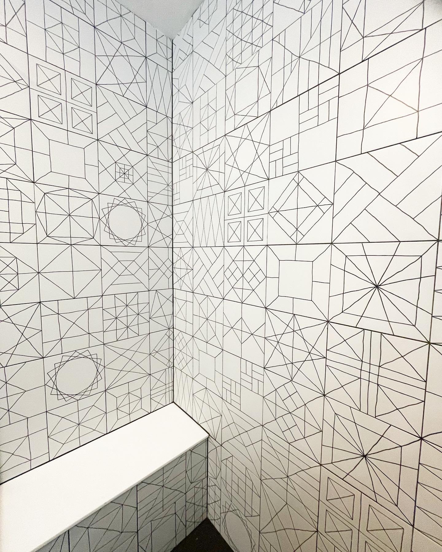 Close-up of shower tile with geometric patterns