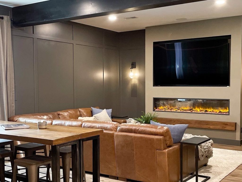 Game room with large built-in TV and fireplace