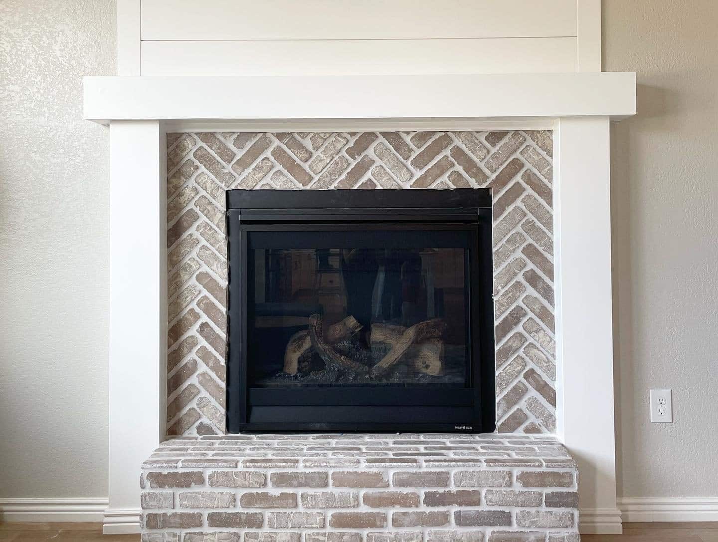 Modern gray brick fireplace with white mantel