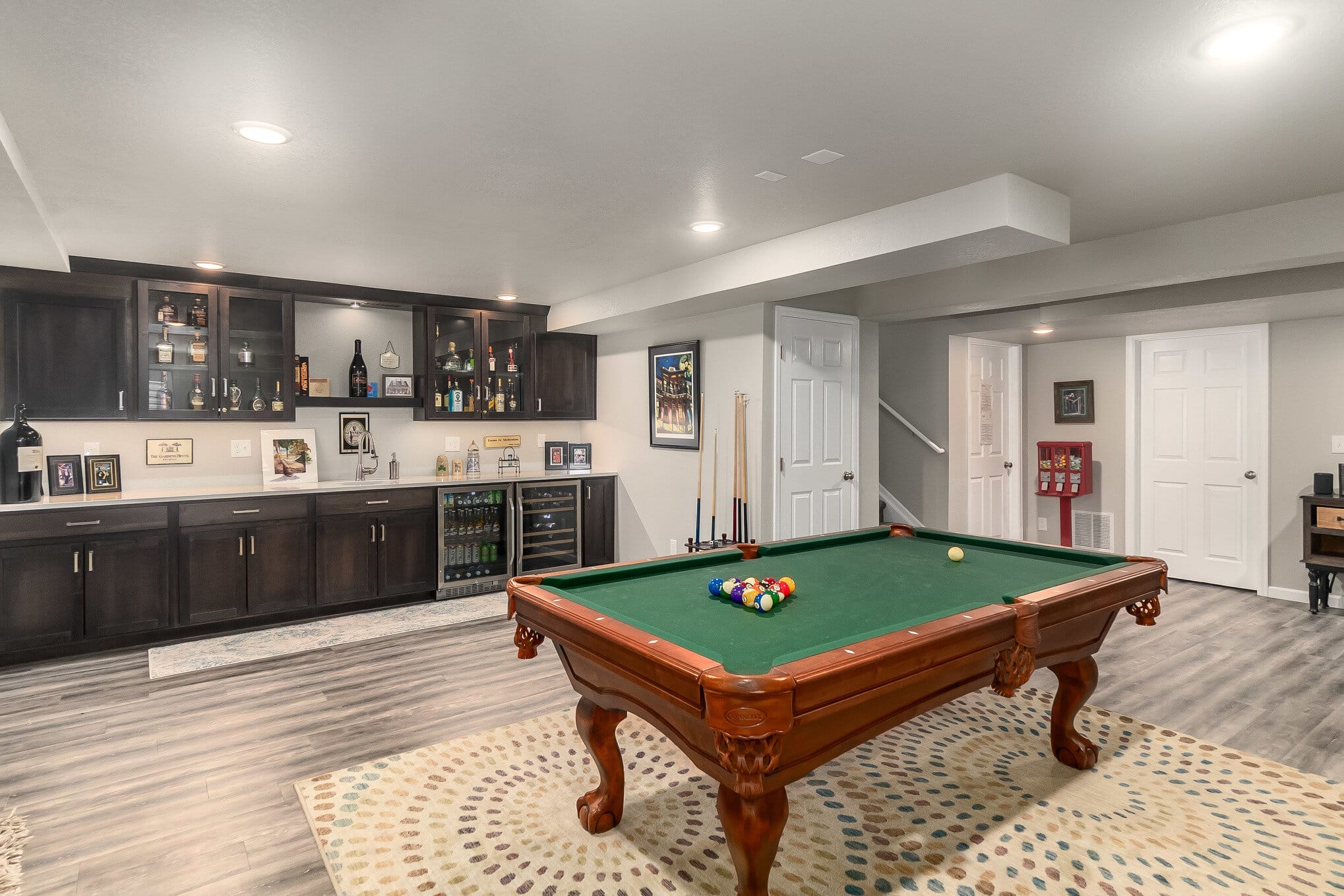 Downstairs game room with pool table and wet bar