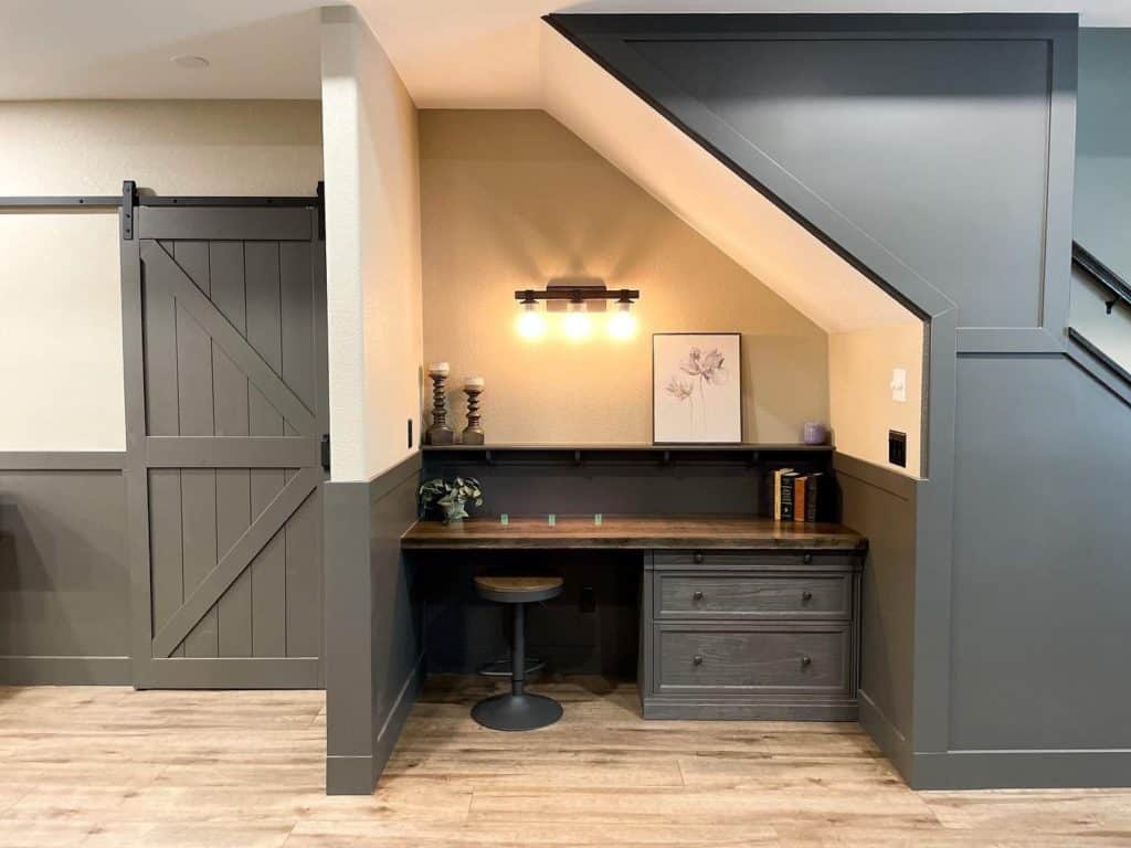 Built-in desk nestled under the stairs in a modern home