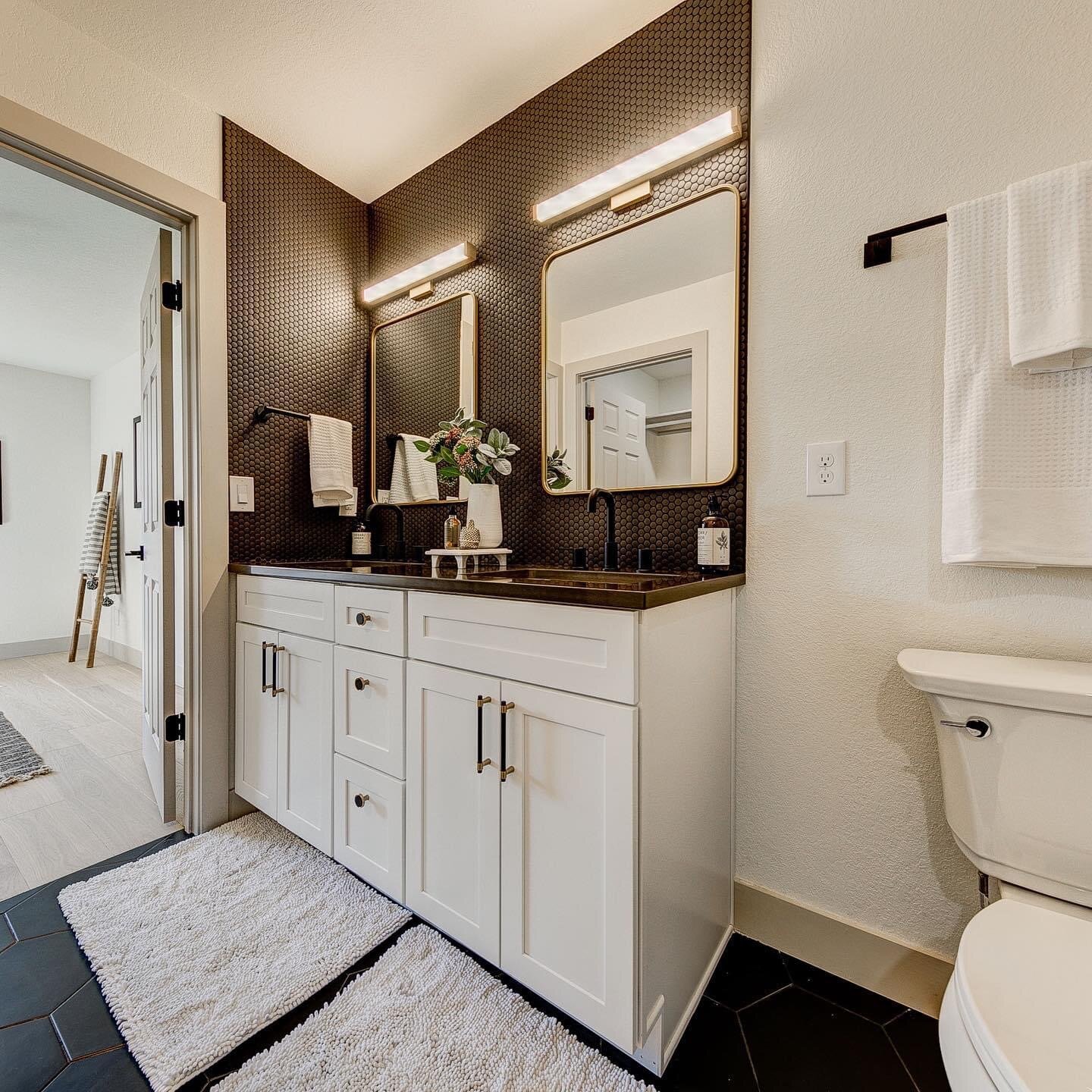 Double bathroom vanity with dark honeycomb tile